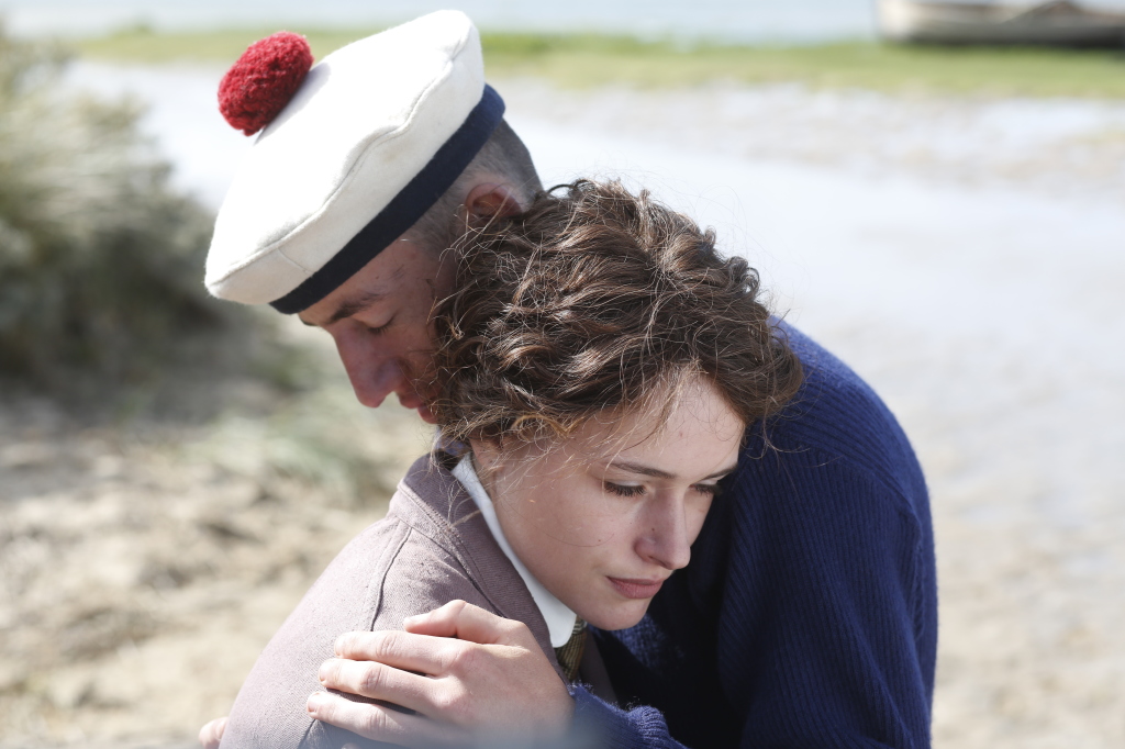 Brandon Lavieville and Raph share an embrace in Slack Bay (Photo courtesy of Kino Lorber)